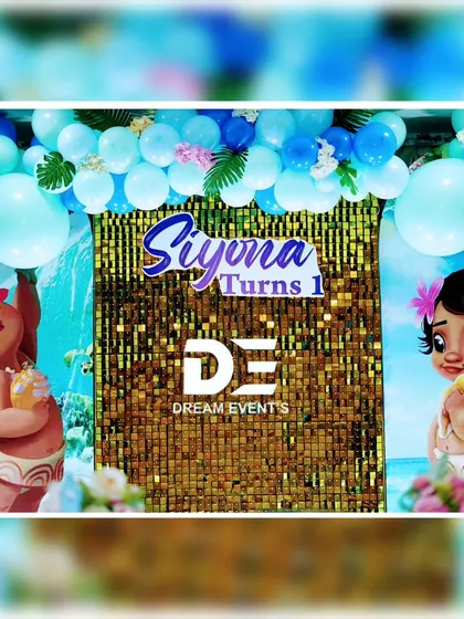 A close-up of the Moana backdrop, featuring baby Moana and a vibrant blue and gold color scheme.