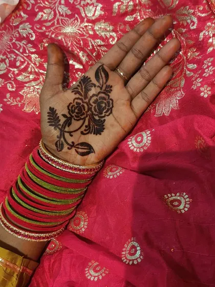 See how easy it is to get a beautiful design with my mehndi stencils. This shows a floral vine stencil applied to the palm. You just stick the stencil, apply the henna paste over it, let it dry, and peel it off for a perfect outline.