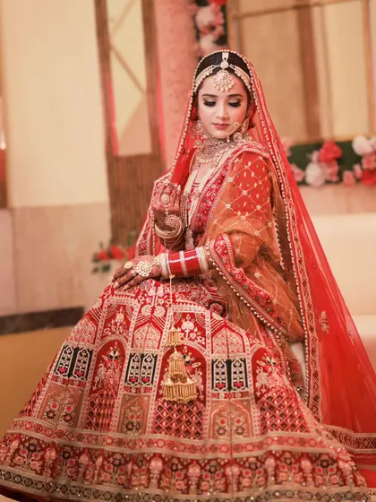 A serene and elegant portrait. The bride's makeup is soft and glowing, perfectly complementing her delicate features.