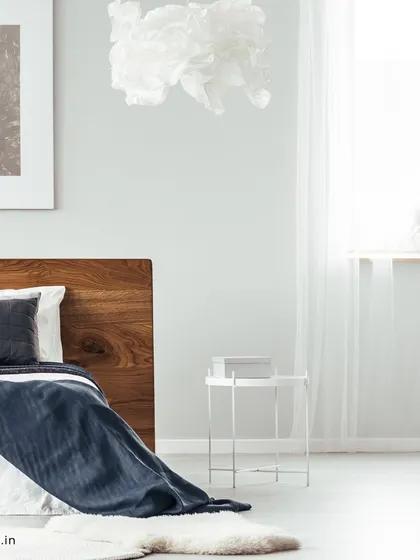 Another angle of the minimalist bedroom, highlighting the clean lines, ample natural light, and the serene atmosphere created by the simple decor.