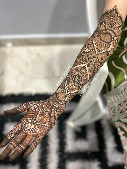 Another angle of Madeeha's full arm bridal henna, highlighting the detailed patterns and clean lines.
