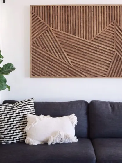 This geometric stick wooden wall art uses intersecting lines to create a dynamic, almost architectural feel. It's a perfect centerpiece for a modern or minimalist home.