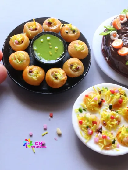 A close-up of a pani puri and dahi puri miniature, capturing the essence of Indian street food.