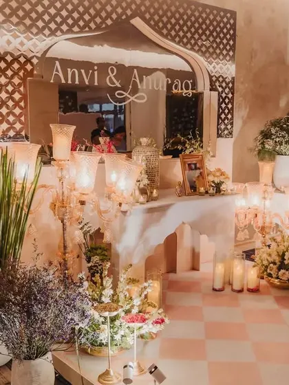 This welcome corner set the tone for modern royalty. We used a custom mirror with the couple's names, traditional candelabras, and lush florals to transport guests into a bygone era of romance.