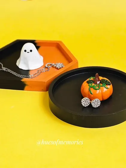 A set of two spooky trinket trays, one hexagonal with a ghost and one round with a pumpkin. They make a great pair for displaying your Halloween treasures.