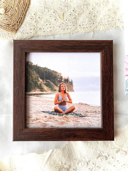 A simple and elegant 6x6 inch dark wood frame, perfect for showcasing a single, beautiful photo. Sometimes, less is more.