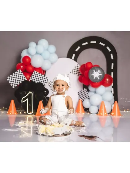 The aftermath of a fun race car cake smash! This little guy is covered in cake and happiness.