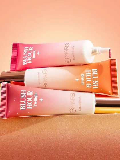 A stacked product shot of the Mars "Blush Hour" range. The warm, sandy texture and gradient background evoke the feeling of a sunset, tying into the product's theme.