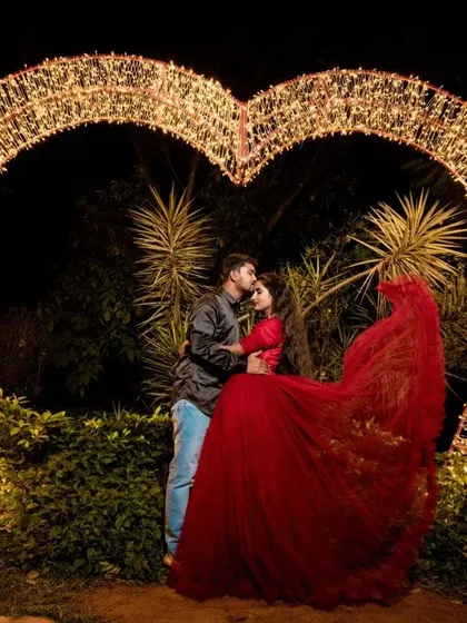 A duplicate of ID 78, this photo shows a couple sharing a tender moment inside a large, heart-shaped light installation, creating the ultimate romantic portrait.
