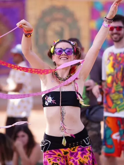 A dancer with a ribbon adds a splash of color and movement to the scene. It's these small, dynamic details that bring event photos to life.