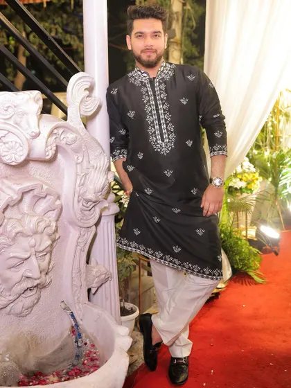 Another angle of our popular black and white kurta. The classic color combination and detailed embroidery make it a go-to choice for festive occasions.