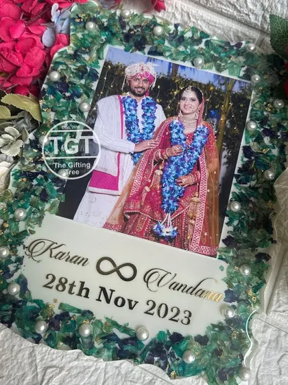 A final look at the green and blue varmala frame, a beautiful memento of a special day.