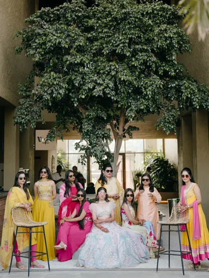 The bride with her squad. This cool and stylish group photo captures the fun and friendship of the bride and her bridesmaids during the pre-wedding festivities.