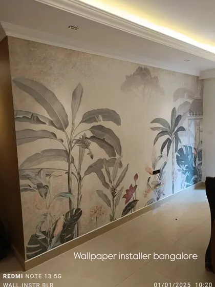 A vintage-style tropical mural with muted colors, giving a sophisticated and worldly feel to this living space.