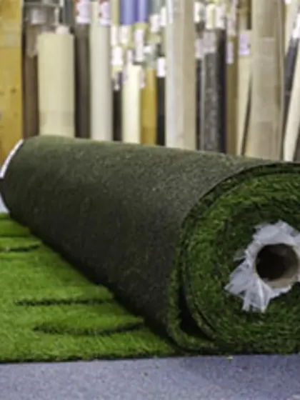 This is a view of my warehouse stock, showing a large roll of turf ready for a project. As a wholesaler, I keep a wide variety of artificial grass rolls on hand for quick supply and installation.