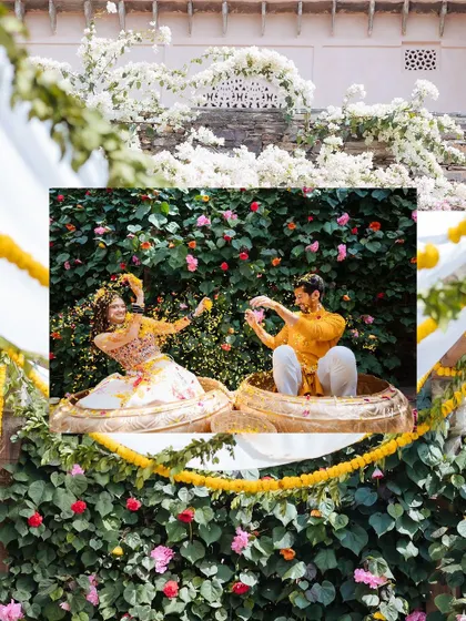 A creative shot of the couple in their Haldi outfits, framed by a wall of bougainvillea.