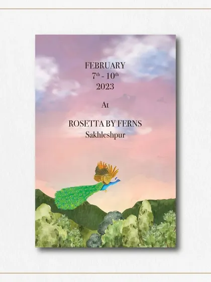 This save the date card showcases the stunning Sakleshpur destination with a custom illustration of a peacock flying over the hills at sunset. It's a breathtaking preview of the wedding's scenic location.