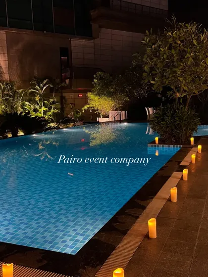 Even simple elements can create a romantic mood. Here, I've lined the edge of the swimming pool with electric candles, providing a soft, warm glow that enhances the proposal setting.