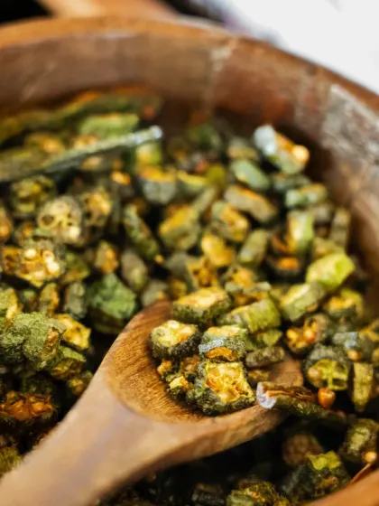Crispy fried okra, or 'kurkuri bhindi', is a beloved Indian side dish. I serve it as a crunchy, savory element in my wedding menus, offering a taste of home-style comfort.