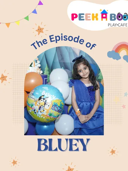 The birthday girl looking picture-perfect at her "Bluey" themed celebration, surrounded by character balloons and festive decor.