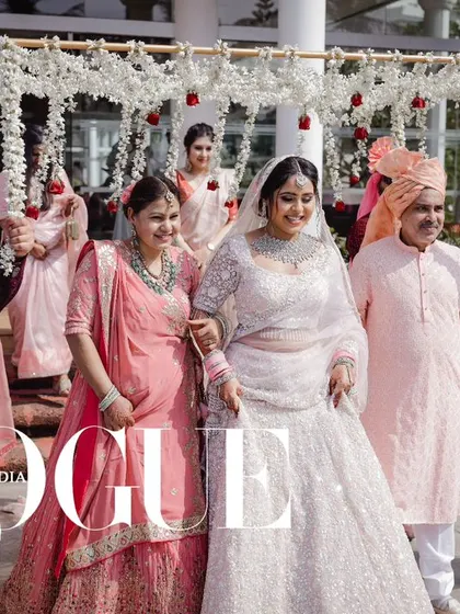 The bride's grand entrance with her family at her Goa wedding, a moment featured in Vogue India.