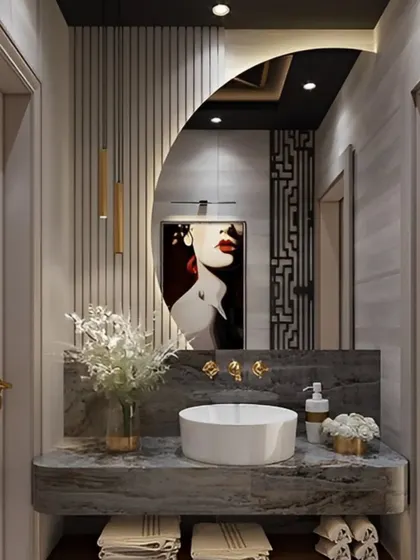 An artistic and bold powder room design. I used a uniquely shaped mirror that reflects a piece of modern art, creating a stunning visual effect against the marble and fluted wall panels.