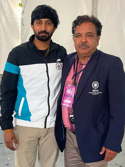 With a senior official from the Indian Olympic Association. Building relationships with key figures in the sports administration helps me create better opportunities for my athletes.