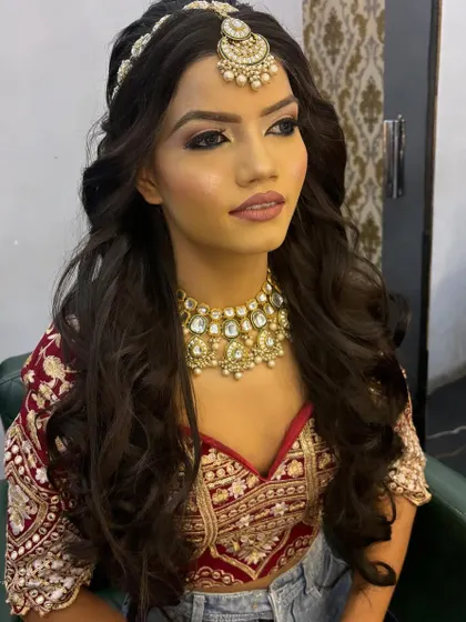 A student practice session creating a bridal look. This image shows a soft glam eye with a defined crease and a flawless base, perfect for a sangeet or engagement ceremony.