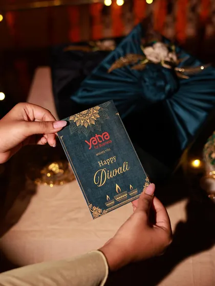 A personalized touch for the Yatra corporate gifts. I design and include custom cards to match the company's branding and festive theme.