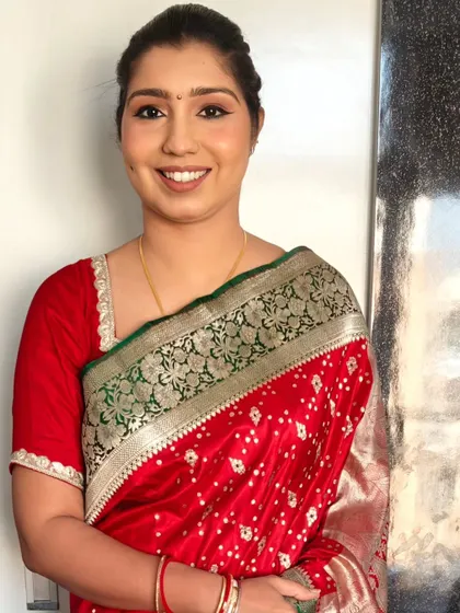 Her smile says it all! This HD makeup look is perfect for a wedding guest, providing a flawless finish that lasts.