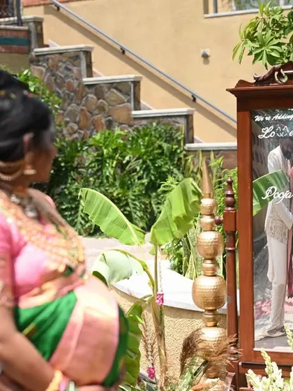 A beautiful moment captured at a baby shower. We also provide custom props like this engraved mirror for a unique photo opportunity.