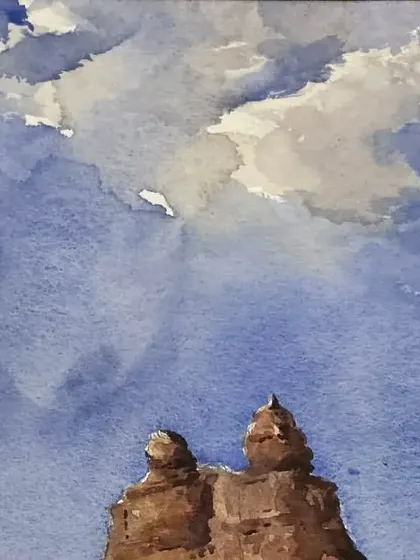 A detailed view of the sky in the Hampi watercolor painting. Capturing the movement of clouds is a key part of landscape painting, and watercolors are excellent for achieving soft, blended effects.
