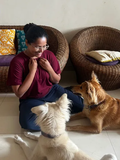 A moment of shared understanding with two dogs. My body language is open and non-threatening, inviting them to interact at their own pace and building a foundation of mutual respect.