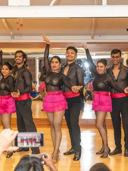 Our Bachata performance team taking a bow after their performance. The smiles on their faces say it all. We are so proud of their hard work and dedication.