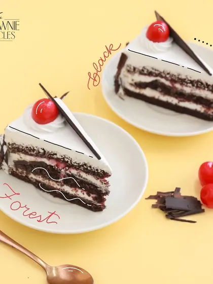 Two slices of my German Black Forest cake, a timeless classic. I make it with light chocolate sponge, whipped cream, and a hint of cherry.