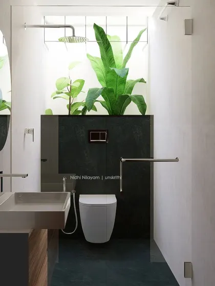 A bathroom is a place to pause. We brought nature directly into this space with a skylight and a dedicated planter for lush greenery. The design uses clean lines, a wall-mounted toilet, and a frameless glass partition to create an open, uncluttered, and soothing environment where your mind can feel free.