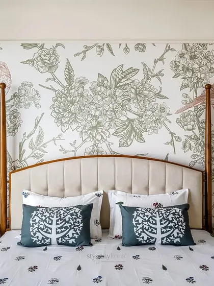 Sometimes, all a bedroom needs is a touch of charm. We introduced this beautiful bird Chinoiserie wallpaper behind the bed to add character without overwhelming the room's simple, calming design.