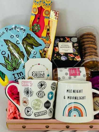 A special Rakhi hamper designed for both Bhaiya and Bhabhi, including two unique mugs, cookies, a face mask, and a beautiful lumba rakhi set.