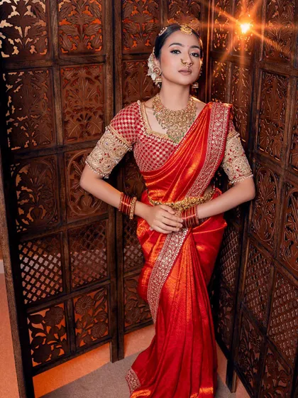 Posed against a traditional backdrop, this red saree look embodies the heart of South Indian bridal fashion. It’s a piece I am very proud to have in my collection.