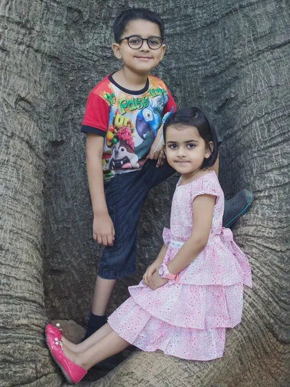 Brothers and sisters create a beautiful picture together. This outdoor portrait captures the unique connection and personalities of these two siblings.