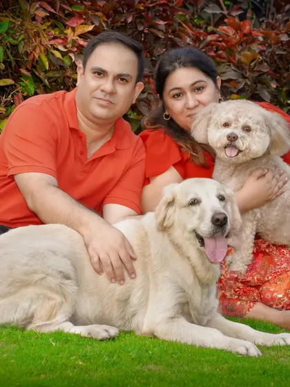 A classic family photo with two dogs, perfect for a framed print.