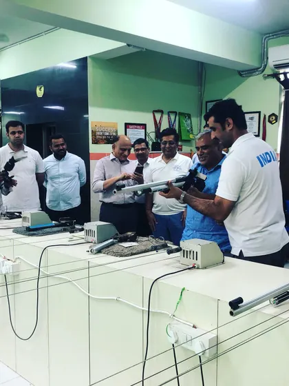 Explaining the mechanics of an air rifle to an interested group. These sessions are not just about shooting, but also about learning and appreciating the sport.