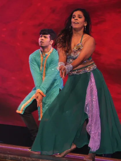 A moment of intense expression during a stage performance. I teach my students that dance is not just movement, but also storytelling and emoting.