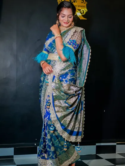 A full-length view of the blue Banarasi saree, showcasing the rich fabric and the unique, modern styling.