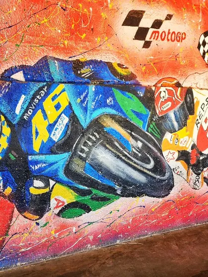 A close-up view of the MotoGP racers, highlighting the details on the bikes and the sense of motion we created with the paint splatters and background.