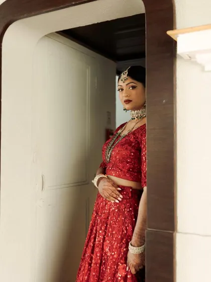 A final, dramatic portrait. Kavi's reception look was all about glamour, confidence, and celebrating in red.