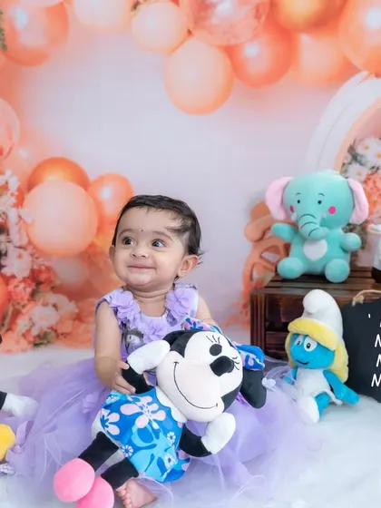 A big smile for her favorite Disney characters. We can incorporate any theme or character to make your child's photoshoot extra special.