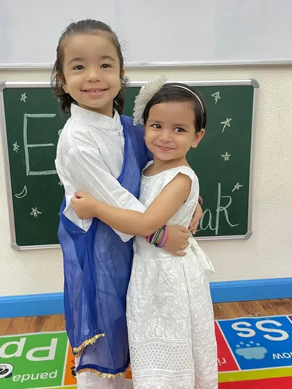 Two friends share a warm hug during our Eid celebration. We teach our children that festivals are about love, friendship, and sharing joy with one another.