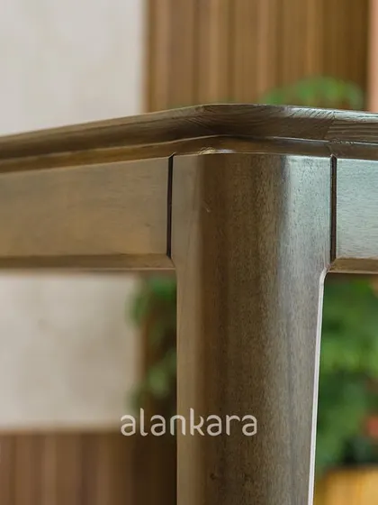 A close-up of the Zircon table's corner, revealing the precision of the joinery and the smooth, rounded edges. I personally inspect every detail to ensure a flawless finish.
