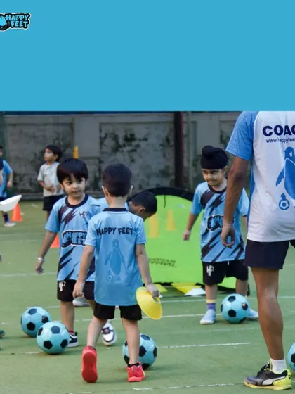 Our field is always buzzing with activity. In this shot, kids are getting ready for a drill, each with their own ball, ensuring maximum participation and learning time for everyone in the group.